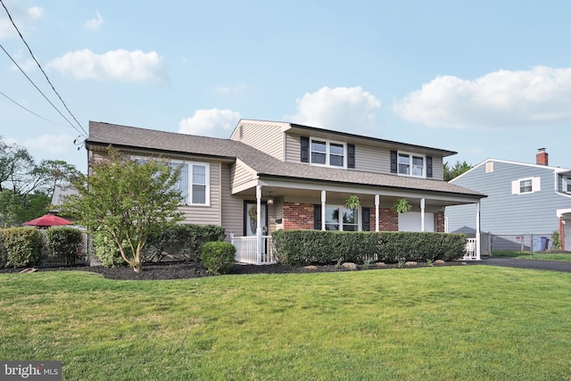 48 Evergreen Ln, Burlington, NJ 08016 - split level home with brick siding, a shingled roof, a front yard, and aphalt driveway
