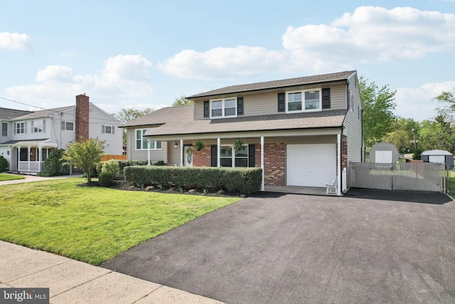 48 Evergreen Ln, Burlington, NJ 08016 - traditional-style home featuring driveway, a front yard, brick siding, fence, and a storage unit