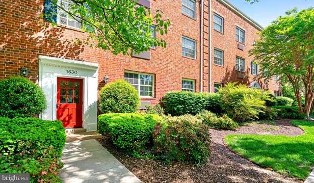 1630 W Abingdon Dr Unit 102, Alexandria, VA 22314 - entrance to property featuring brick siding