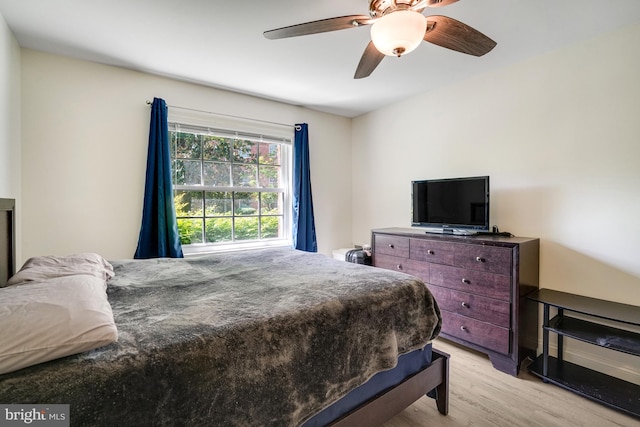 bedroom featuring ceiling fan and light wood-type flooring