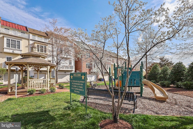 communal playground featuring a gazebo and a yard