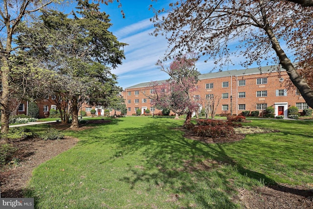 surrounding community with a lawn