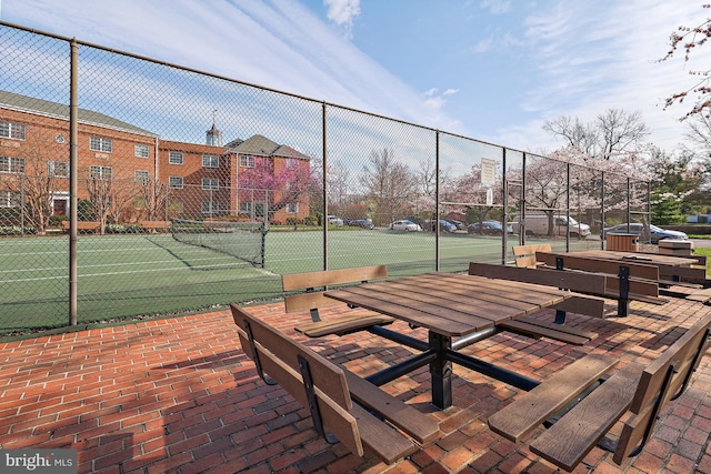 view of tennis court with fence