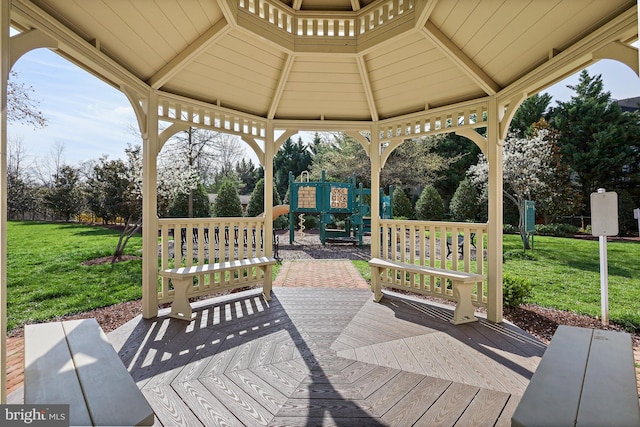 view of patio featuring a gazebo, a wooden deck, and a playground