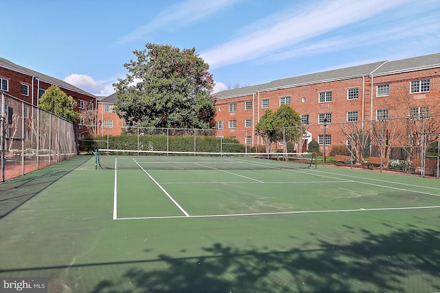 view of sport court with fence