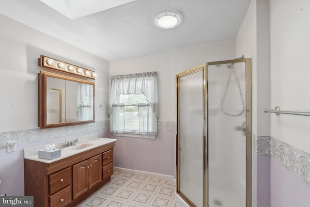 bathroom featuring vanity and a shower stall
