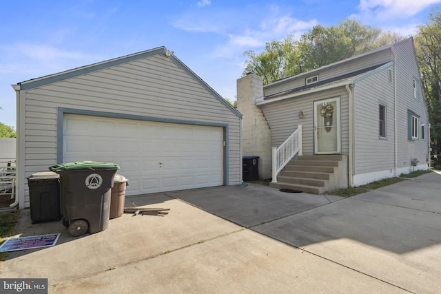 view of front of house with an outbuilding and a garage