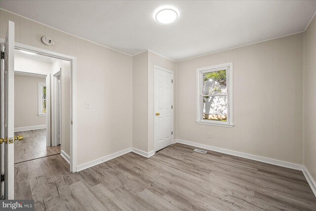 2708 Old Ocean City Rd, Salisbury, MD 21804 - empty room with healthy amount of natural light, wood finished floors, a smoke detector, and baseboards