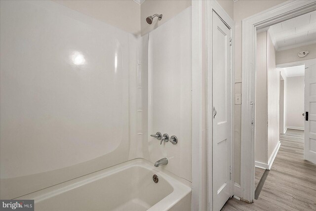 2708 Old Ocean City Rd, Salisbury, MD 21804 - bathroom with shower / washtub combination, wood finished floors, baseboards, and ornamental molding