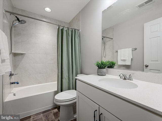 bathroom featuring vanity, toilet, shower / bathtub combination with curtain, recessed lighting, and visible vents