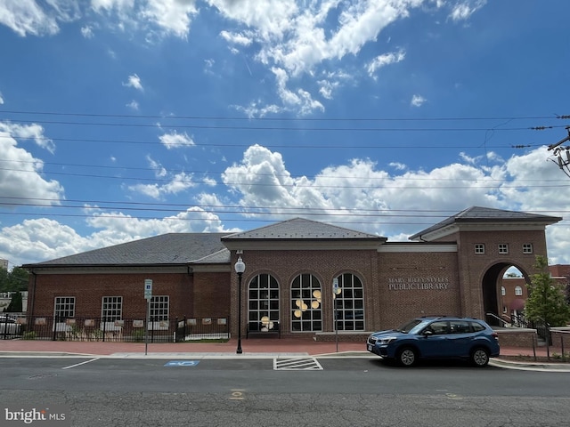 view of building exterior featuring fence