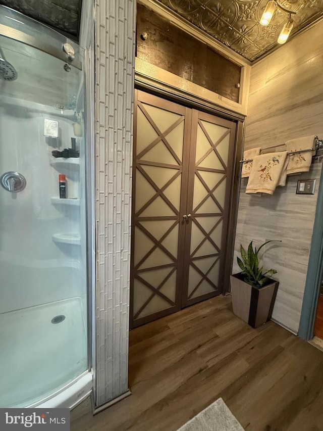 interior space featuring wood walls and wood finished floors