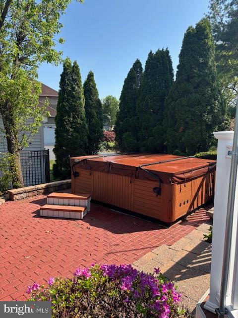 view of yard featuring a patio and a hot tub