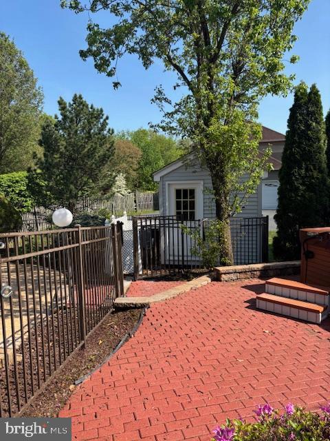 view of patio featuring fence