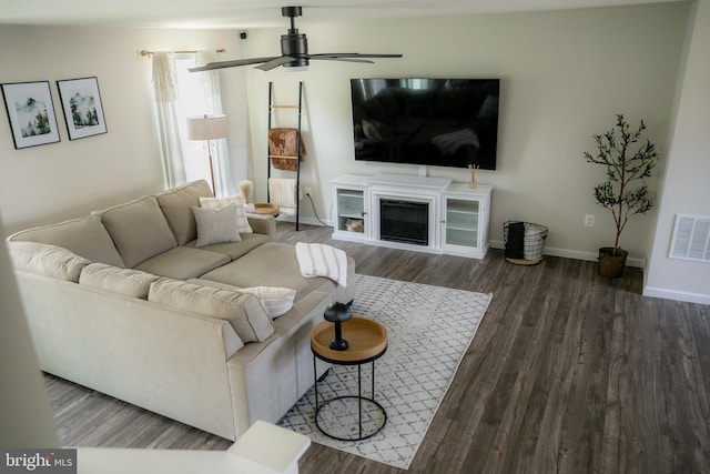 300 Coville St, Middletown, VA 22645 - living area featuring ceiling fan, a glass covered fireplace, baseboards, wood finished floors, and visible vents