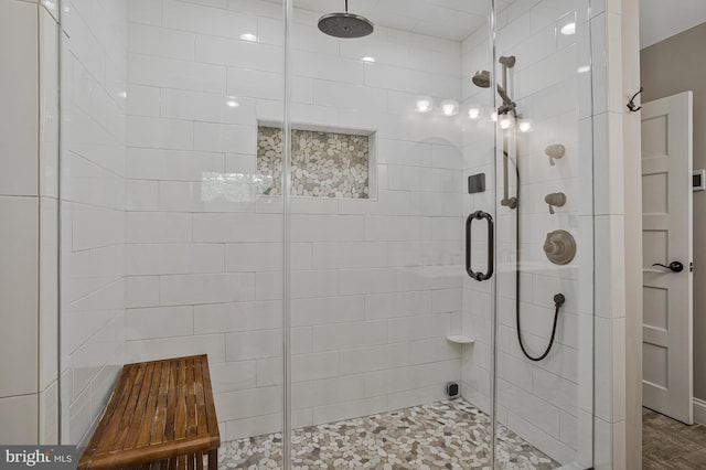 full bathroom featuring a shower stall