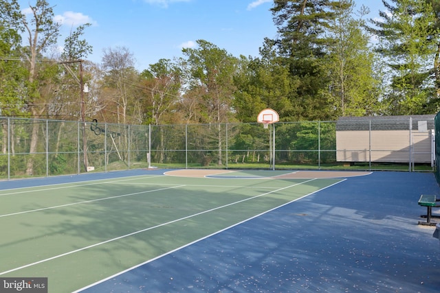 view of basketball court with fence and community basketball court
