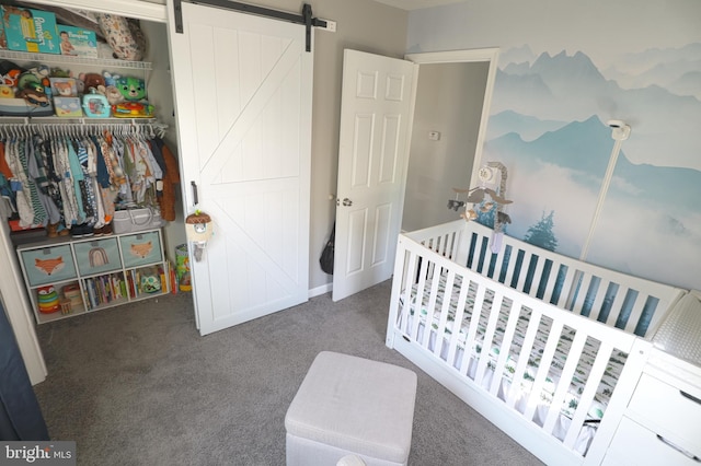 221 Arundel Rd, Pasadena, MD 21122 - carpeted bedroom with a nursery area, a closet, and a barn door