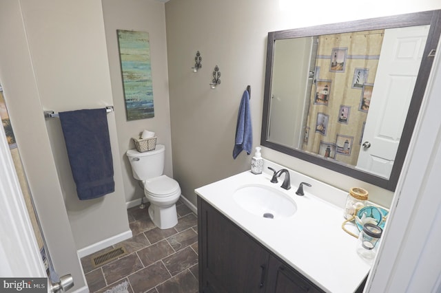 221 Arundel Rd, Pasadena, MD 21122 - bathroom featuring vanity, baseboards, toilet, and visible vents