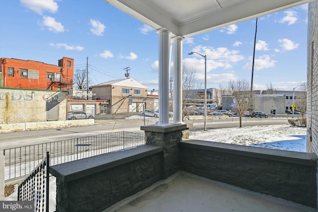 view of patio featuring a porch and a residential view