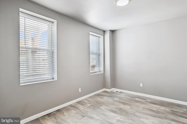 empty room with baseboards