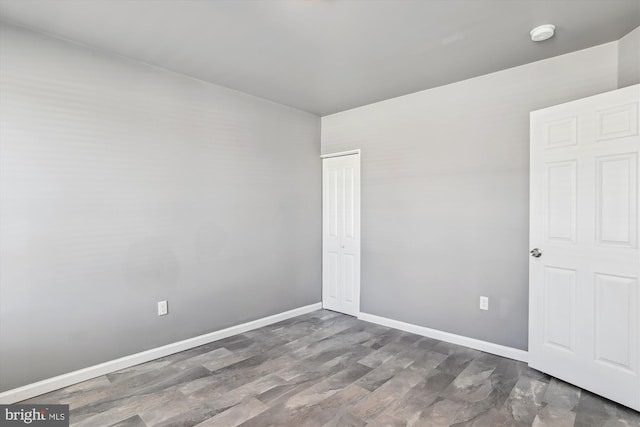 spare room featuring baseboards