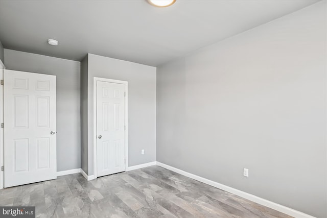 unfurnished bedroom featuring baseboards