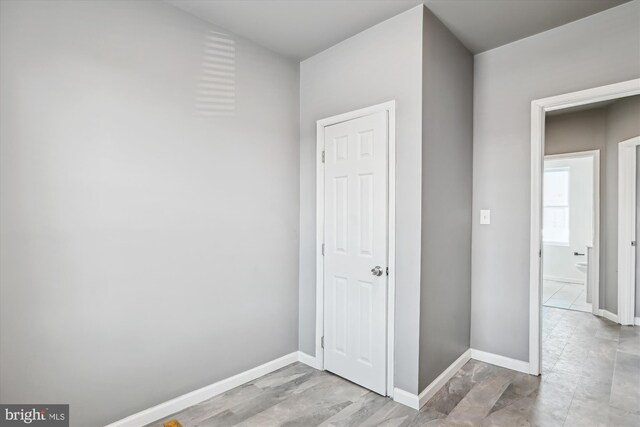 interior space featuring baseboards