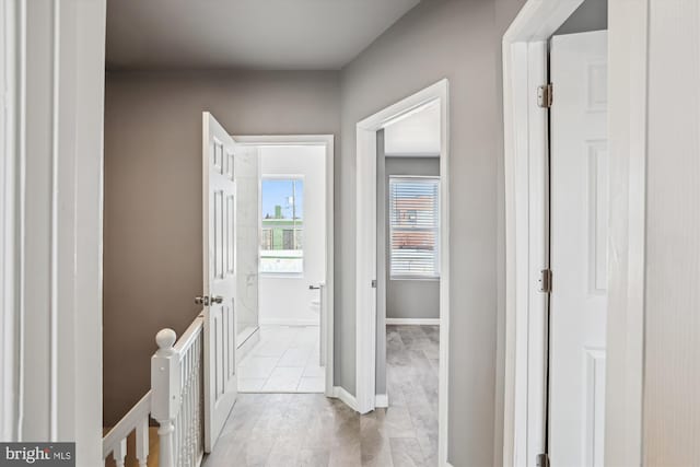 bathroom featuring baseboards and toilet
