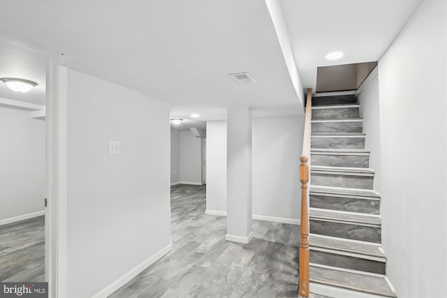 staircase featuring recessed lighting, baseboards, and visible vents