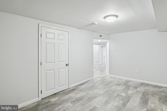 unfurnished bedroom with baseboards and visible vents
