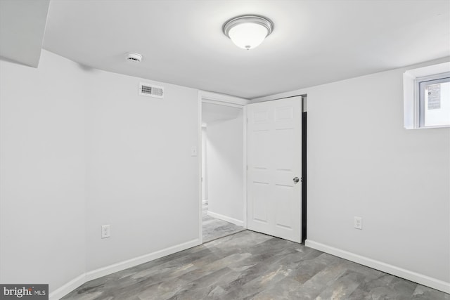 unfurnished bedroom with visible vents and baseboards