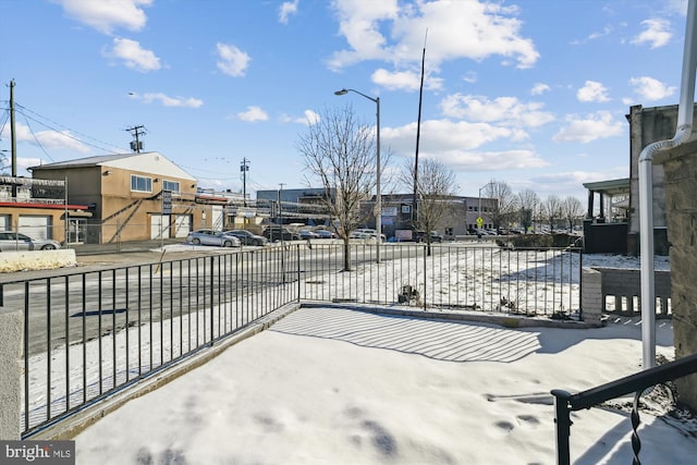 view of patio featuring fence and a residential view