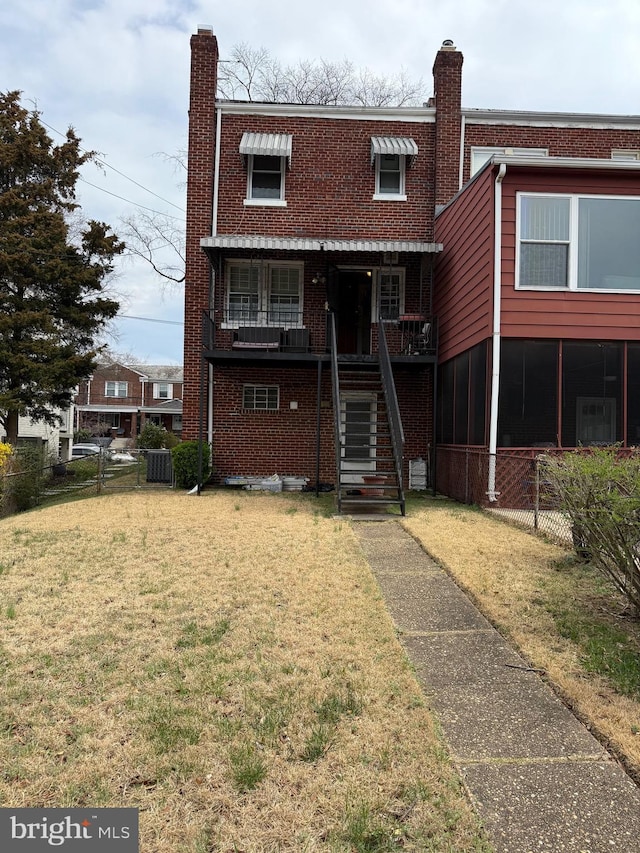 4710 12th St NE, Washington, DC 20006 - view of front facade featuring a chimney, central air condition unit, brick siding, stairs, and covered porch