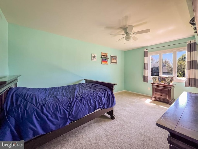 carpeted bedroom featuring ceiling fan
