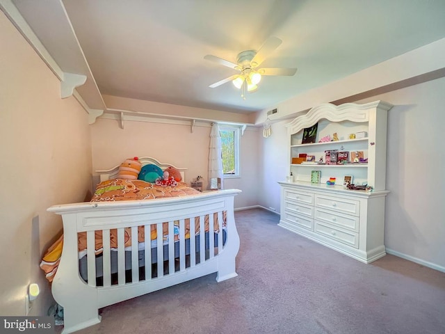 carpeted bedroom featuring visible vents, a ceiling fan, and baseboards