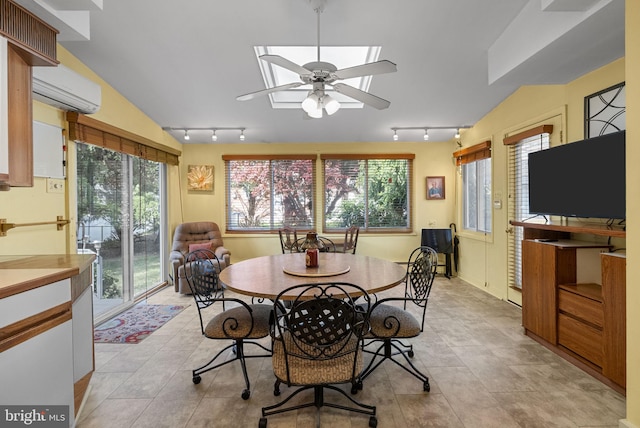 dining area with rail lighting, a wall mounted AC, ceiling fan, and lofted ceiling