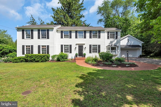 302 Maple Ln, Severna Park, MD 21146 - colonial inspired home with an attached garage, a front yard, driveway, and a chimney