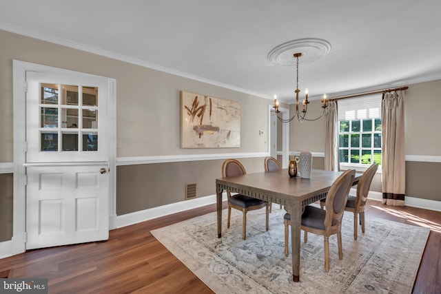 302 Maple Ln, Severna Park, MD 21146 - dining space with a chandelier, crown molding, dark wood-style floors, and baseboards