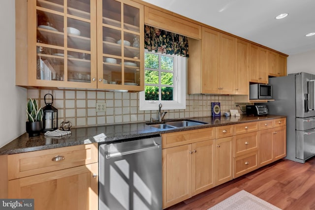 302 Maple Ln, Severna Park, MD 21146 - kitchen with appliances with stainless steel finishes, a sink, tasteful backsplash, glass insert cabinets, and wood finished floors