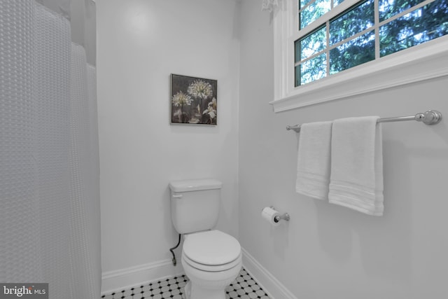 302 Maple Ln, Severna Park, MD 21146 - bathroom with toilet, baseboards, curtained shower, and tile patterned floors