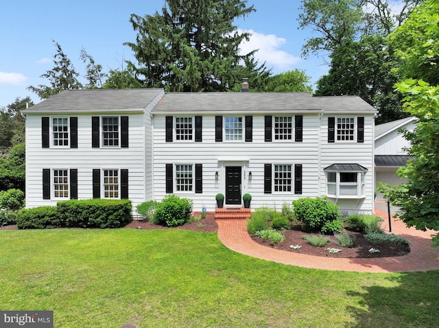302 Maple Ln, Severna Park, MD 21146 - colonial inspired home with a front yard and a chimney