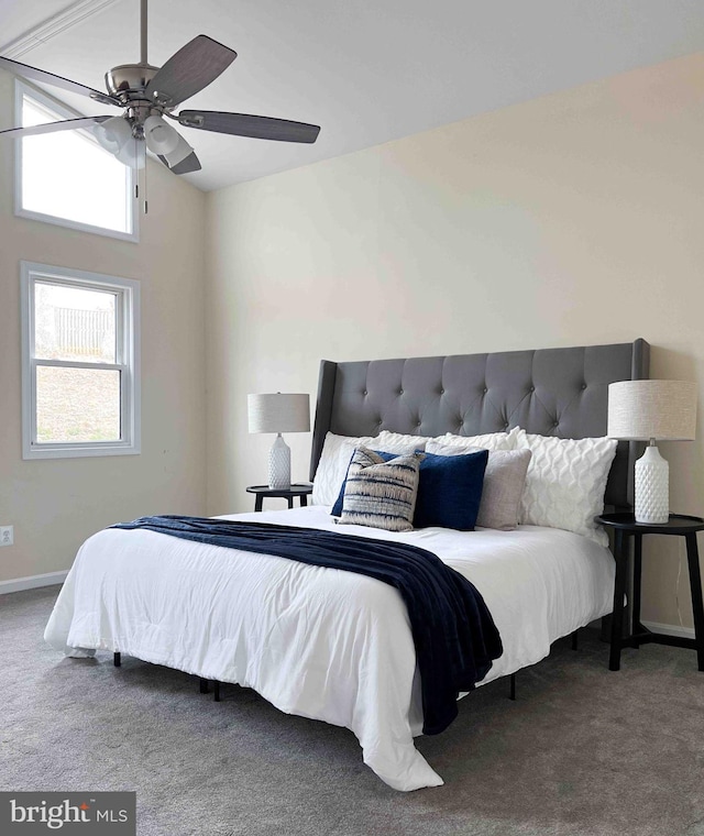 bedroom with baseboards, carpet, ceiling fan, and vaulted ceiling