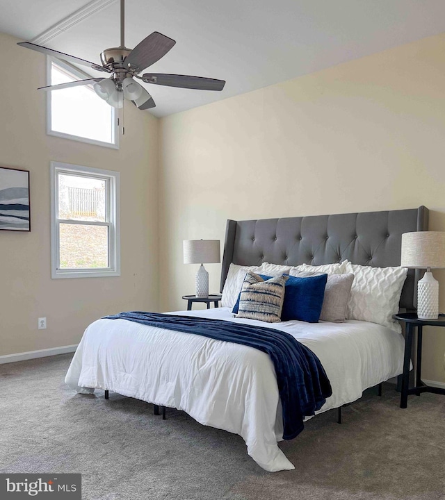 bedroom featuring baseboards, a ceiling fan, carpet, and lofted ceiling