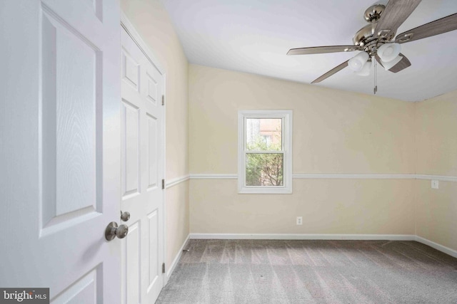 unfurnished room featuring carpet floors, baseboards, and ceiling fan