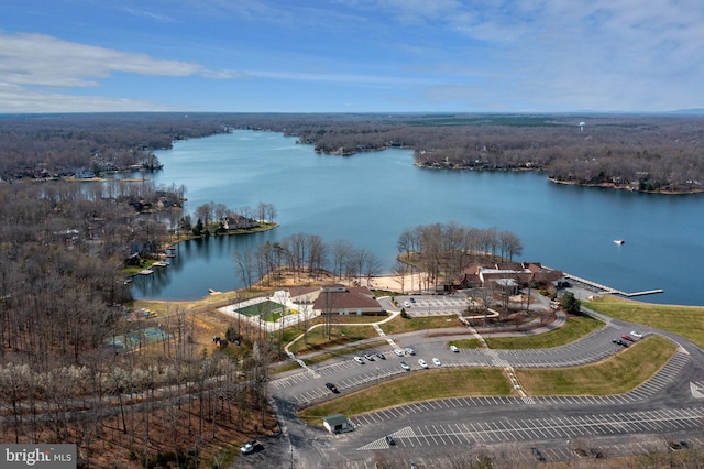 aerial view featuring a water view and a forest view