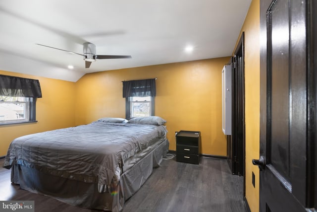 bedroom with wood finished floors, baseboards, recessed lighting, a ceiling fan, and vaulted ceiling