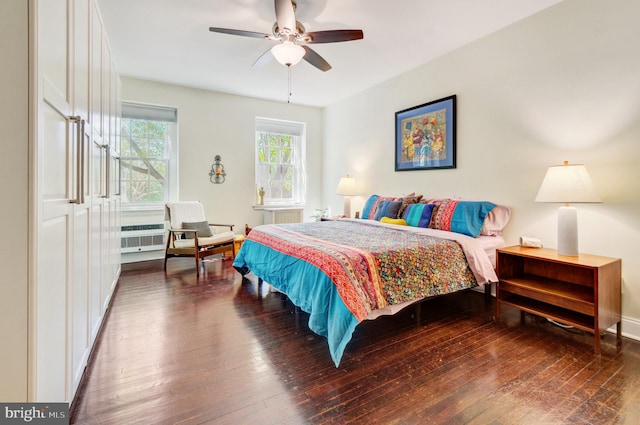 bedroom with wood-type flooring and a ceiling fan