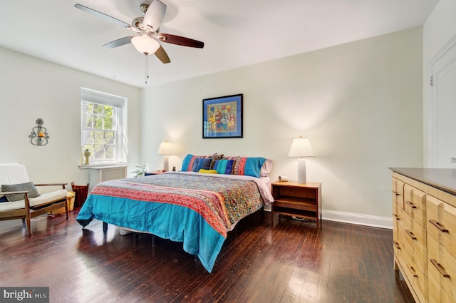 bedroom featuring baseboards, ceiling fan, and hardwood / wood-style floors