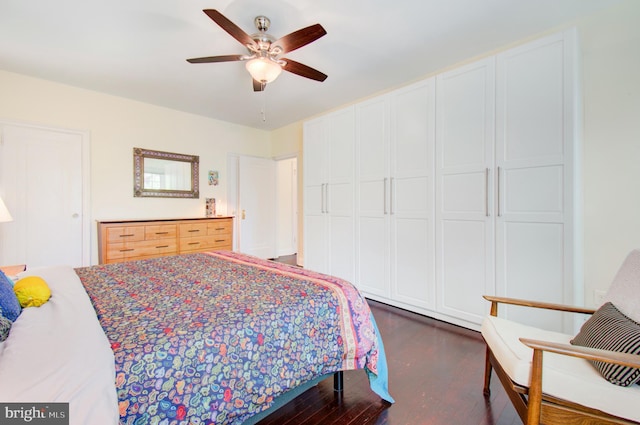 bedroom featuring ceiling fan and dark wood-type flooring
